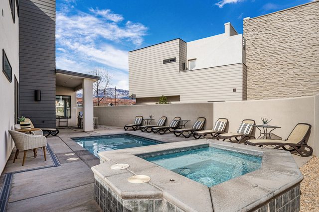 Custom in-ground hot tub beside the private pool