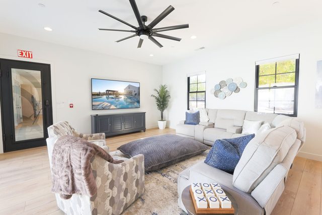 Family room with large smart TV and cream sectional