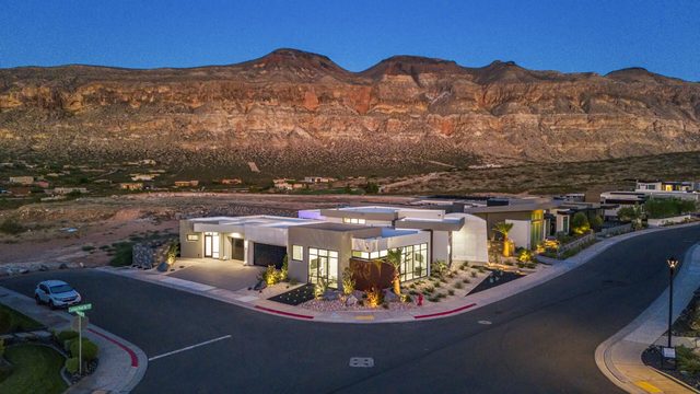Aerial of Copper Rock 3557 at dusk below red cliffs