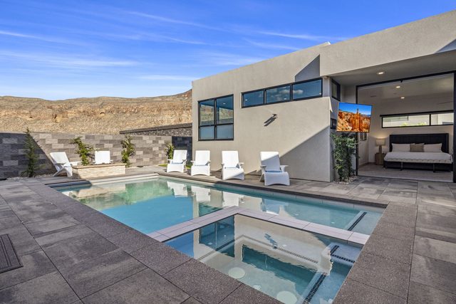 Private pool and spa with loungers in courtyard at Copper Rock 3557