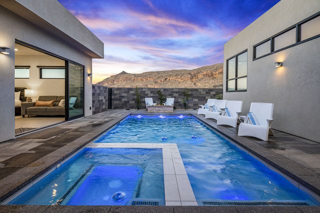 Lit private pool and spa at dusk at Copper Rock 3557