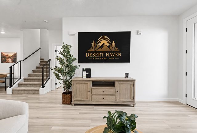 Entry area with staircase, console and Desert Haven wall sign