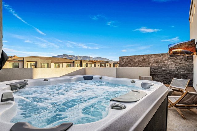 Private rooftop hot tub with outdoor TV and mountain views