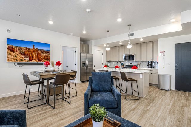 Dining table and kitchen island seen from the living room