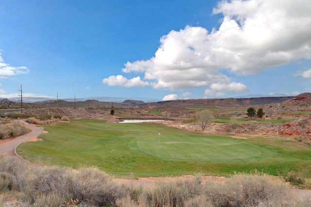 Coral Canyon Golf Course green framed by desert hills