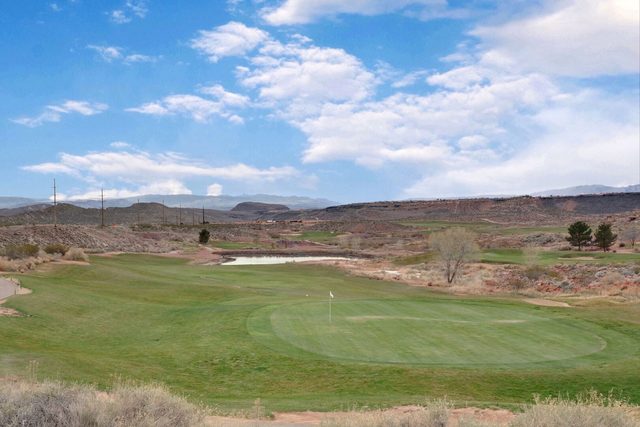 Coral Canyon Golf Course putting green and bunkers in the desert