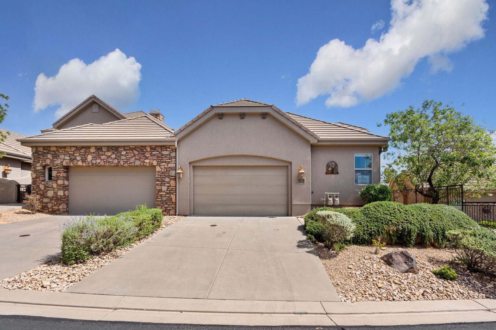 Front exterior of Coral Ridge 1924 with two-car garage and driveway