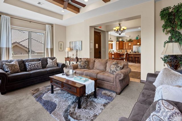 Living room seating area looking toward the kitchen and dining