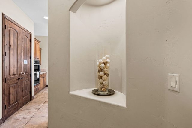 Hallway with decorative wall niche toward the kitchen