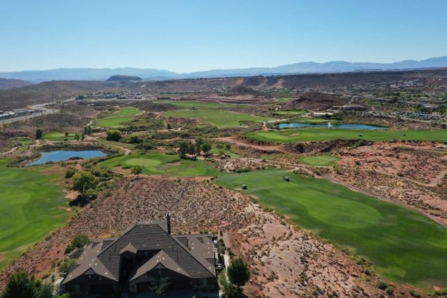 Aerial of golf course fairways and ponds in red rock country