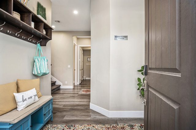 Entry hall with bench, coat hooks and front door