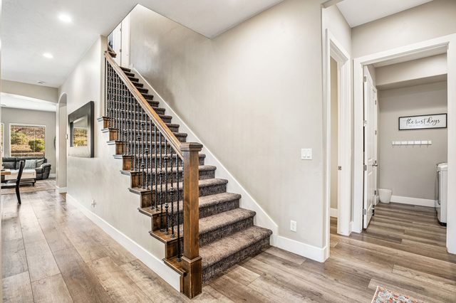 Staircase and hallway leading to the main living area