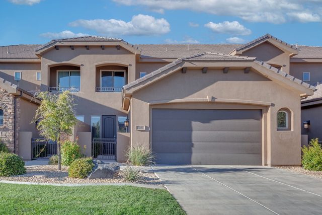 Front exterior and two-car garage of Coral Ridge 2081