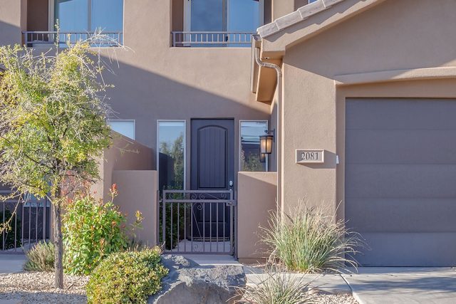 Front entry gate and garage door of Coral Ridge 2081