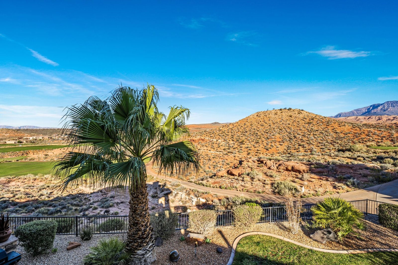 Backyard view of desert hills and golf fairway at Coral Ridge 4098