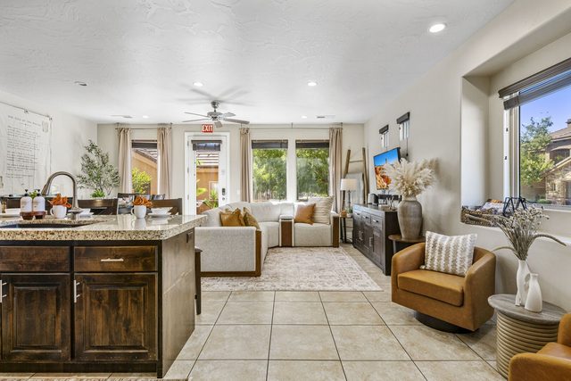 Open kitchen and living room with sectional sofa at Coral Ridge 4144
