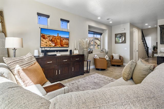 Living room sectional facing TV and media console