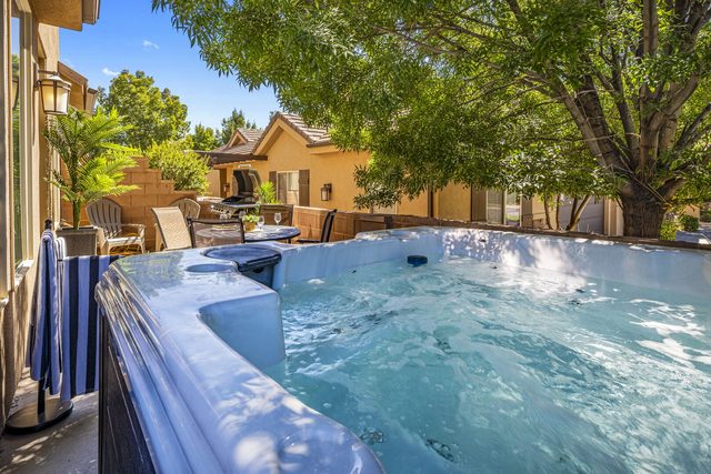 Private hot tub on the shaded back patio at Coral Ridge 4144