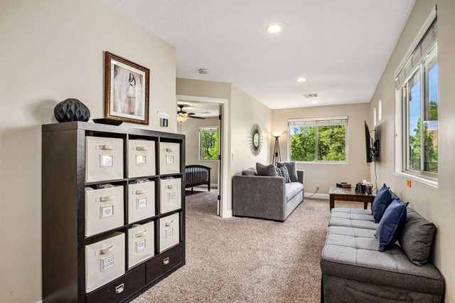 Upstairs loft with sofa sleeper, storage cubbies and TV