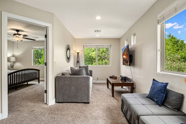 Loft lounge with sleeper sofa and view into a bedroom