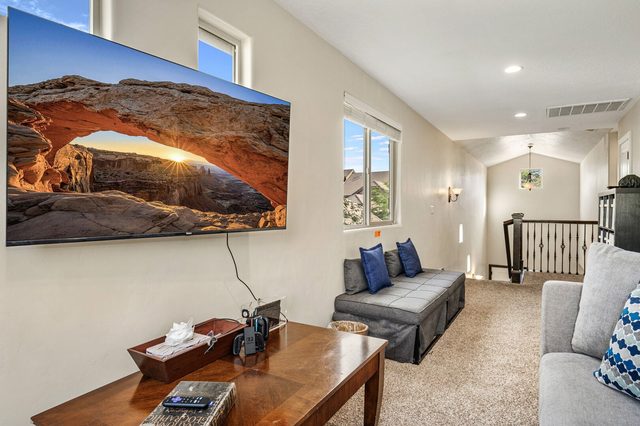 Loft with smart TV, coffee table and foldout seating