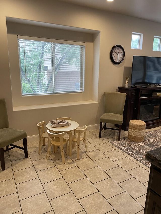 Living room corner with kids table and fireplace TV stand
