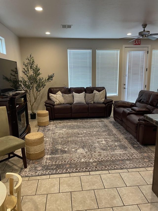 Living room with leather recliners and patio door