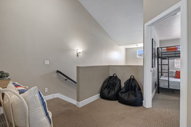 Upstairs loft with bean bags overlooking the stairway