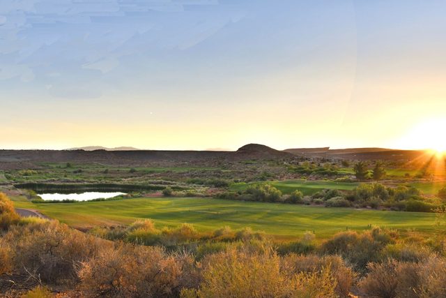 Sunset over a golf course fairway and pond