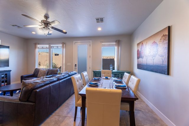 Dining table for six beside the living room seating