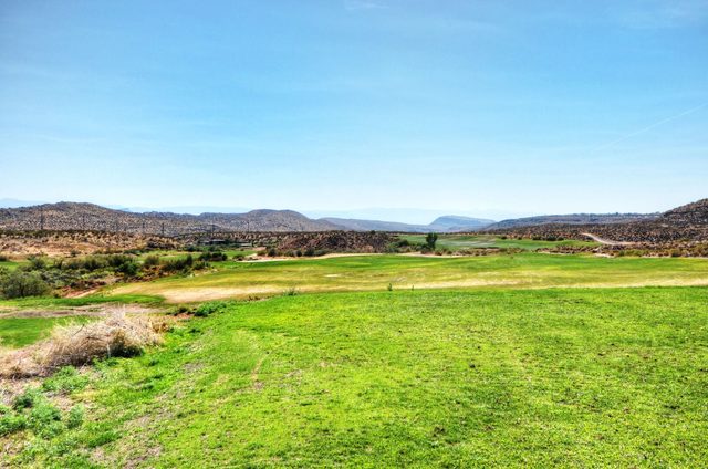 Coral Ridge area golf fairway with desert hills beyond