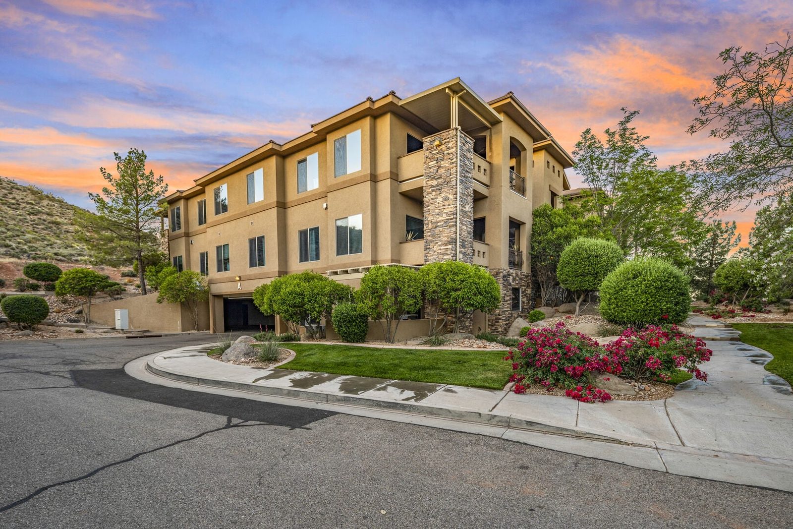 Coral Springs A8 condo building with landscaped entry at sunset