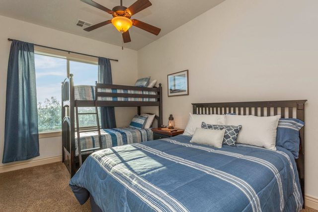 Third bedroom with queen bed and twin bunk bed