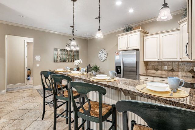 Breakfast bar with four stools and pendant lights