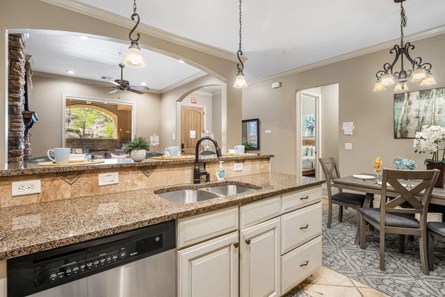 Kitchen sink and dishwasher facing the dining table
