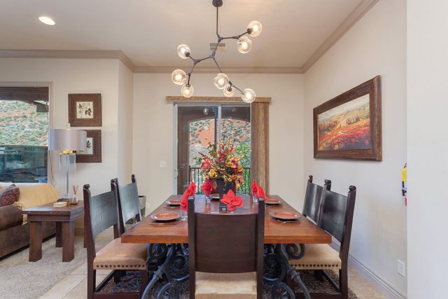 Dining table for eight under a modern chandelier