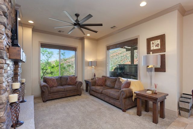 Living room with leather sofas and large windows at Coral Springs B8
