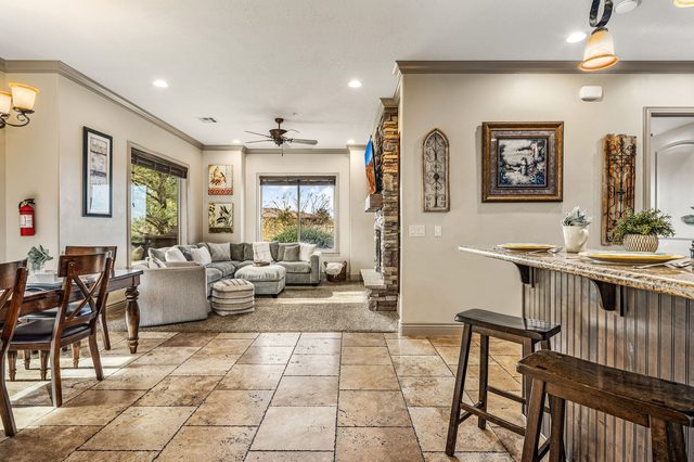 Open living area with dining table and breakfast bar