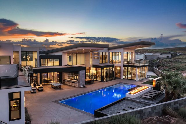 Dusk view of Eleanor at Copper Rock with lit private pool