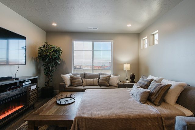 Living room queen sofa sleeper pulled out beside the fireplace