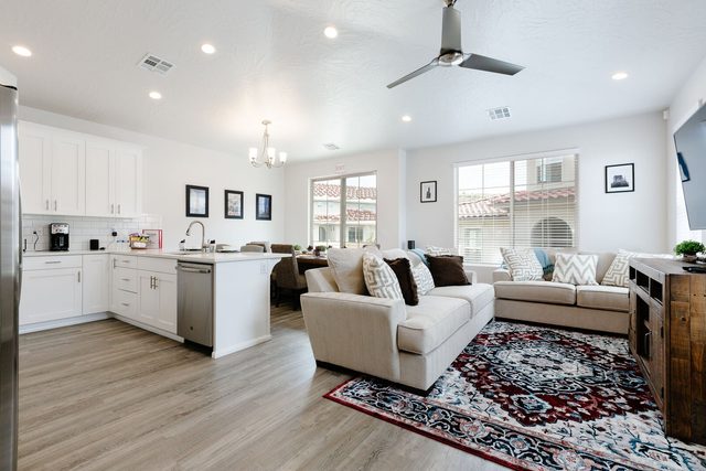 Open living area flowing into the white kitchen at Escondido 1126