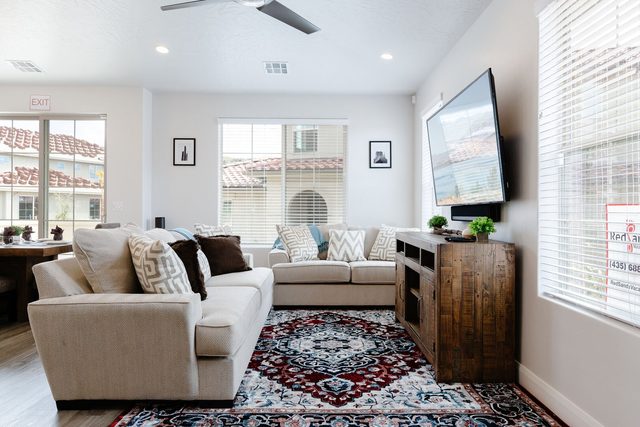 Living room sectional, smart TV and wood media console at Escondido 1126