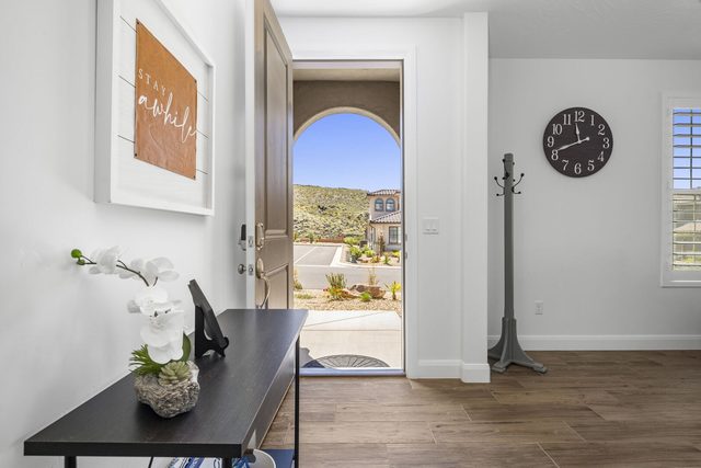 Front entry with console table and open door at Escondido 1145