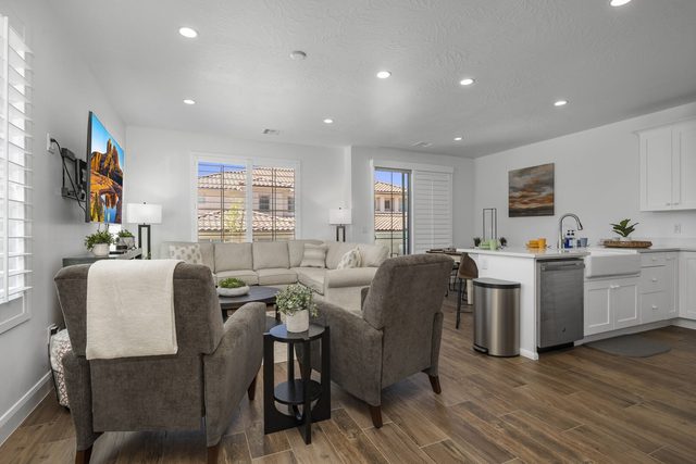 Open living area flowing into the white kitchen at Escondido 1145