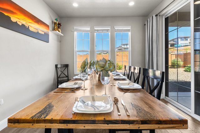 Live-edge style dining table next to patio sliding door