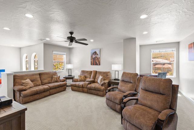 Upstairs family room with recliners and sofas