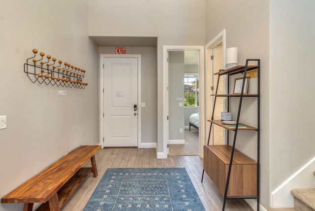 Entry hall with bench, coat hooks and front door