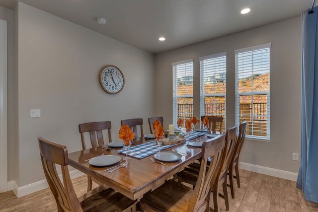 Dining table for eight beside bright windows