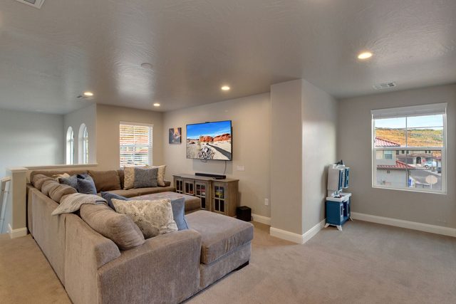 Loft sectional lounge with TV and windows at Escondido 2275