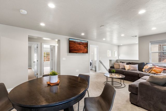 Loft round table and sectional with TV at Escondido 2311